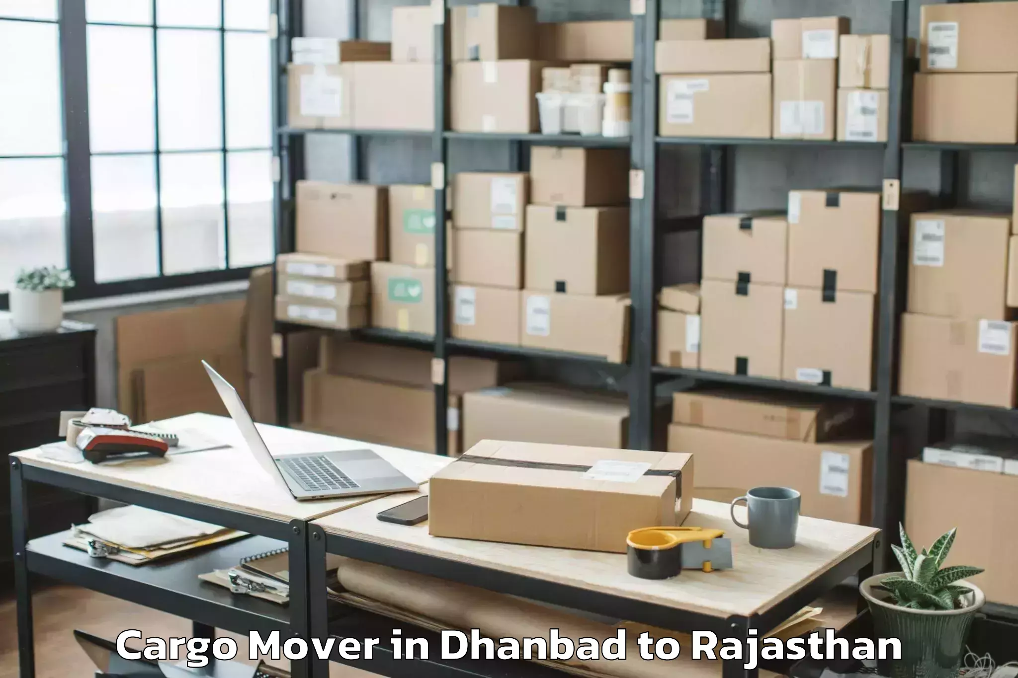 Top Dhanbad to Rajasthan University Of Health Cargo Mover Available